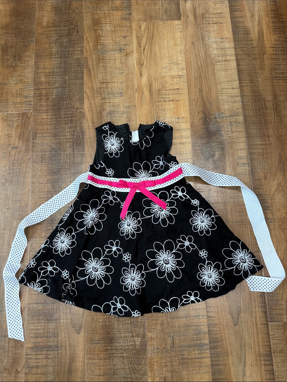 Black Floral Girl's Dress with Pink Accent and Polka Dot Sash